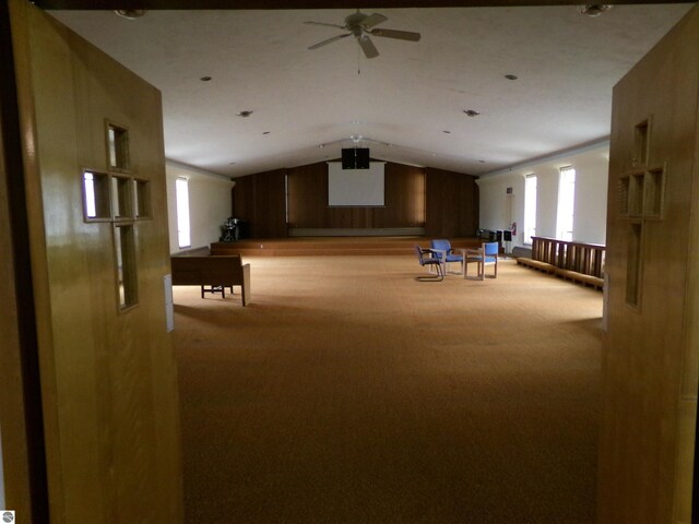 interior space with vaulted ceiling and ceiling fan