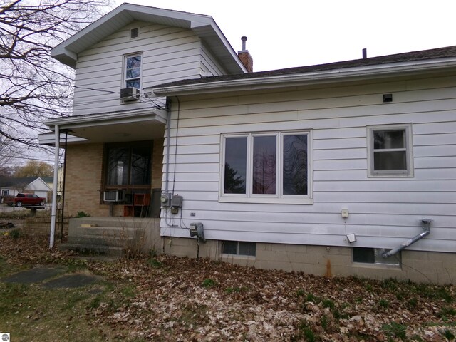 back of house with cooling unit