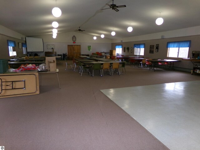 dining room featuring ceiling fan and vaulted ceiling