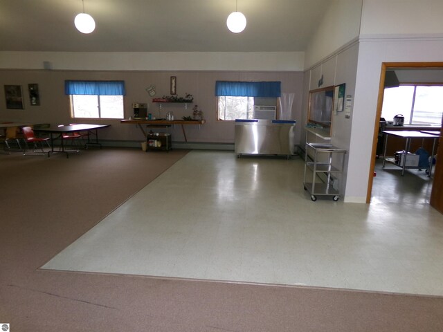 interior space with lofted ceiling and a baseboard radiator