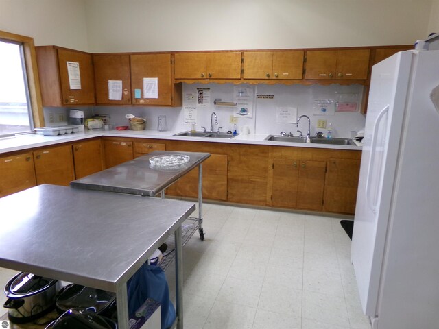 kitchen featuring sink and white refrigerator