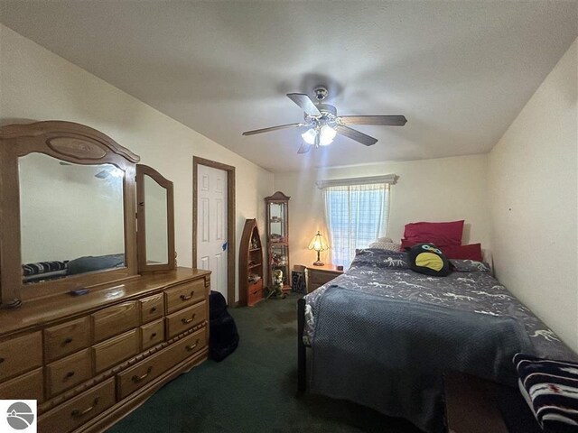 bedroom featuring carpet flooring, vaulted ceiling, and ceiling fan