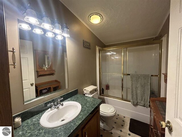 full bathroom featuring a textured ceiling, combined bath / shower with glass door, lofted ceiling, vanity, and toilet