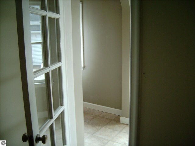413 N Fancher St, Mount Pleasant, MI 48858 - hallway with baseboards and arched walkways