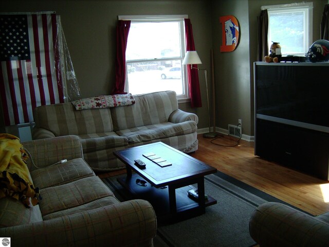 413 N Fancher St, Mount Pleasant, MI 48858 - living room with baseboards and wood finished floors