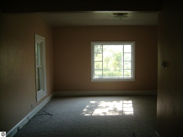413 N Fancher St, Mount Pleasant, MI 48858 - unfurnished room with baseboards and carpet flooring