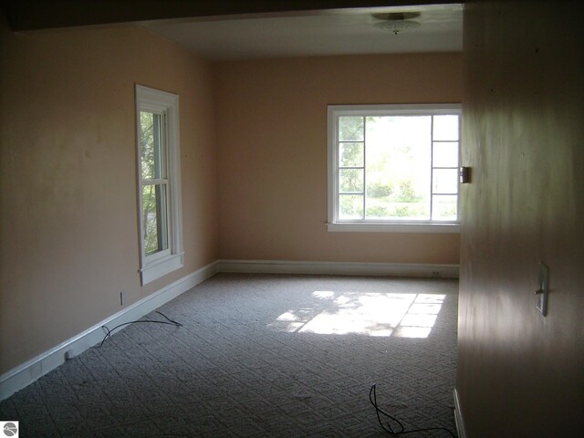 413 N Fancher St, Mount Pleasant, MI 48858 - carpeted spare room with baseboards