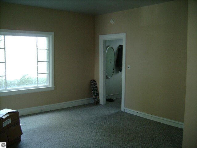 413 N Fancher St, Mount Pleasant, MI 48858 - unfurnished room with baseboards and carpet