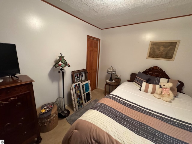 carpeted bedroom featuring a textured ceiling