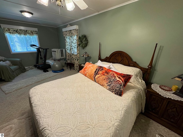 carpeted bedroom featuring ornamental molding and ceiling fan