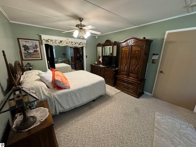 carpeted bedroom with ornamental molding and ceiling fan