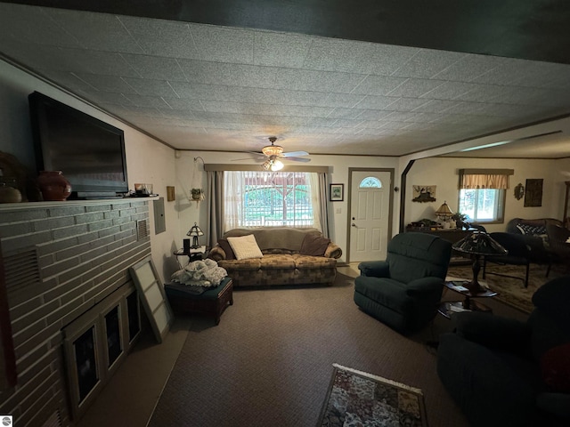 living room with carpet, ceiling fan, and a fireplace