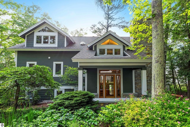 back of property with a porch