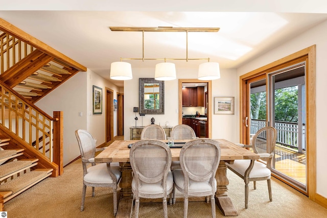 dining room with light colored carpet