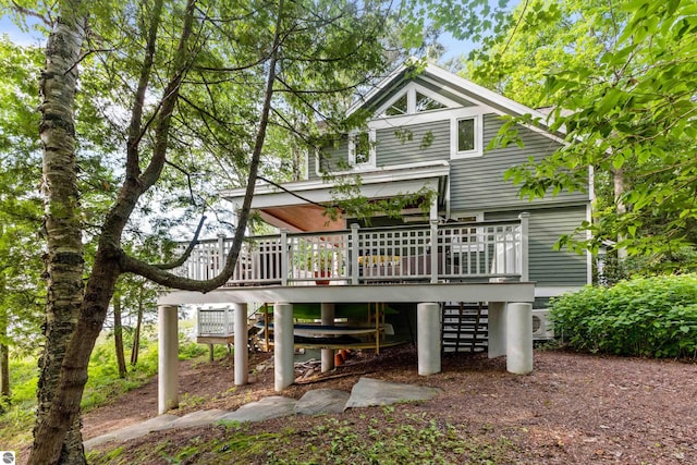 back of house featuring a deck