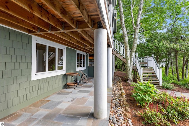 view of side of home with a patio area