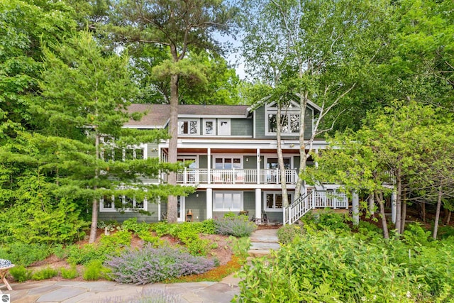 rear view of house with covered porch