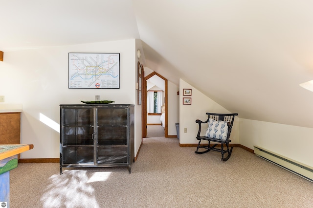 living area with carpet floors, lofted ceiling, and a baseboard heating unit