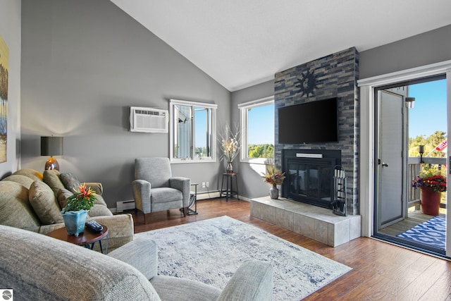 living room featuring high vaulted ceiling, a tile fireplace, hardwood / wood-style flooring, a baseboard radiator, and a wall mounted AC