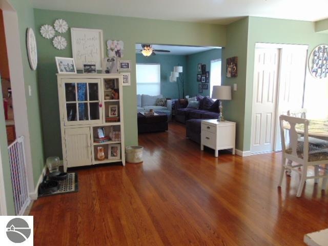 interior space with dark hardwood / wood-style floors and ceiling fan