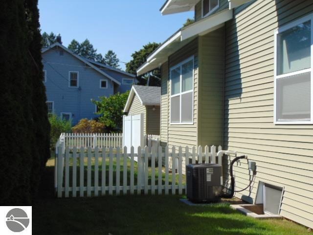 view of property exterior with central AC