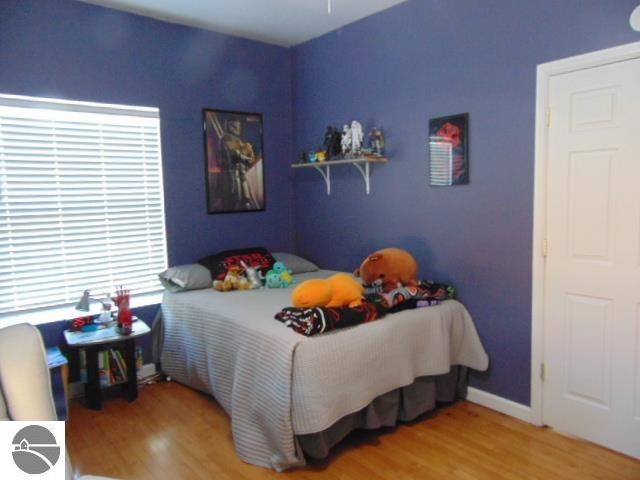 bedroom with hardwood / wood-style floors