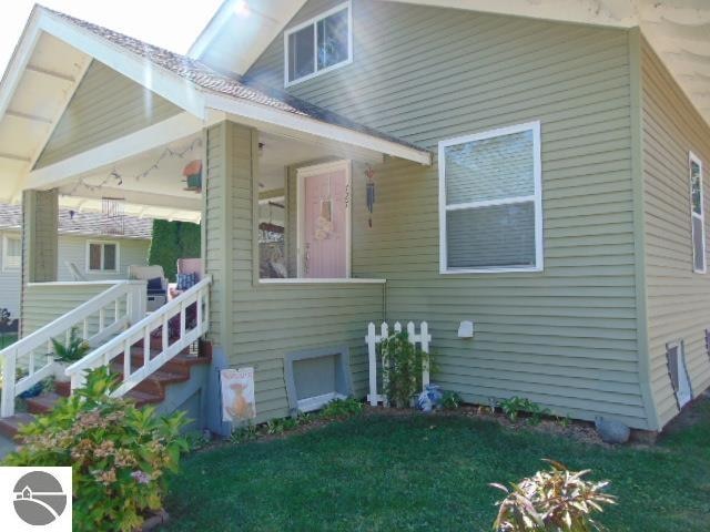 exterior space featuring a gazebo and a front lawn