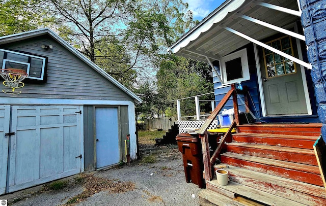 view of side of home with a shed