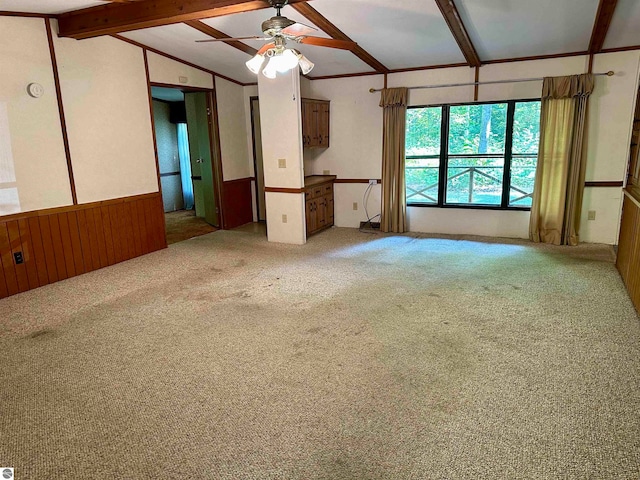 unfurnished living room with carpet flooring, lofted ceiling with beams, and ceiling fan