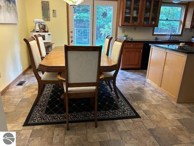 dining room featuring sink