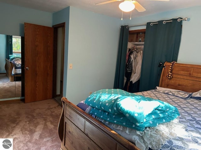 bedroom featuring ceiling fan, a closet, and carpet