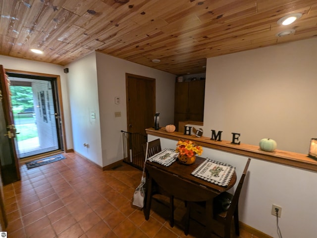 interior space featuring wooden ceiling and tile patterned floors