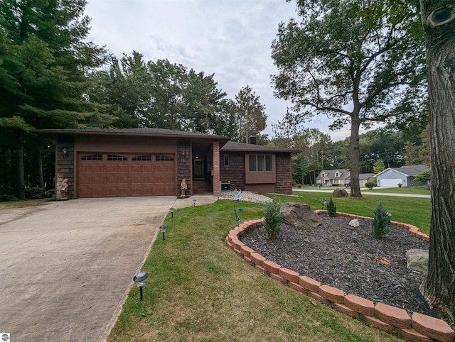 ranch-style home with a garage and a front lawn