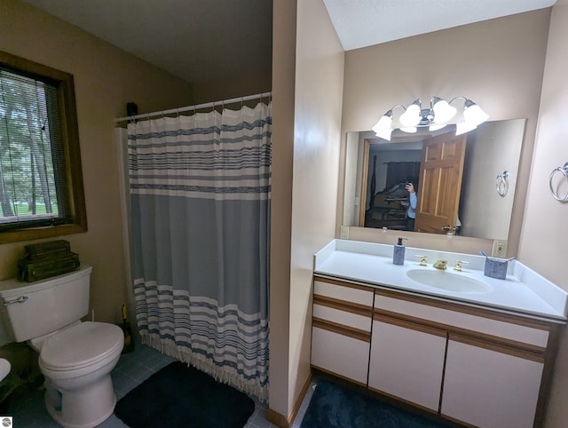 bathroom featuring a shower with curtain, vanity, and toilet