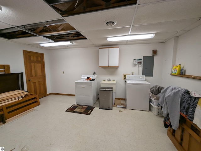 laundry area with cabinets, electric panel, and washing machine and dryer