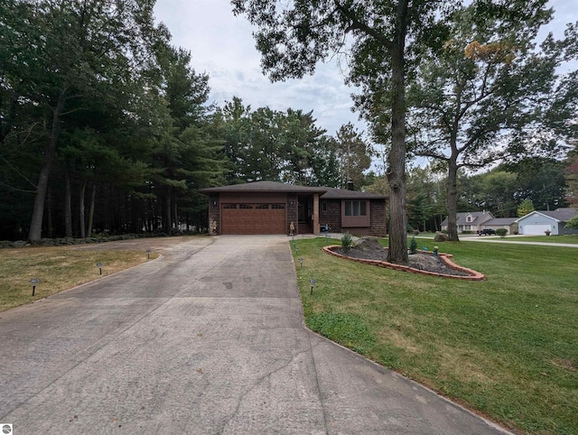 ranch-style home with a garage and a front lawn