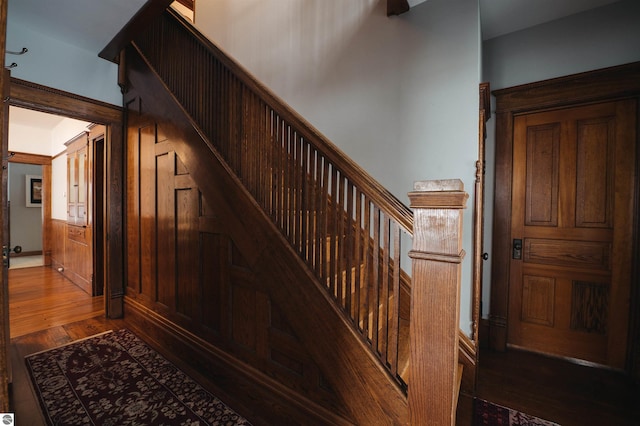 stairway featuring hardwood / wood-style flooring