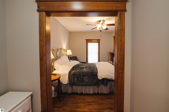 bedroom featuring ceiling fan and dark hardwood / wood-style flooring