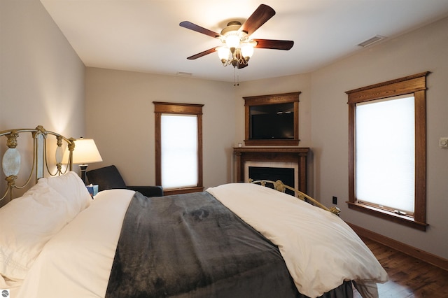 bedroom featuring dark wood-type flooring and ceiling fan