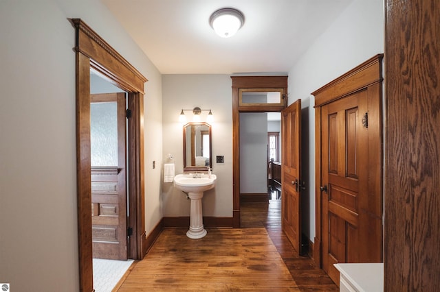 corridor with dark hardwood / wood-style floors