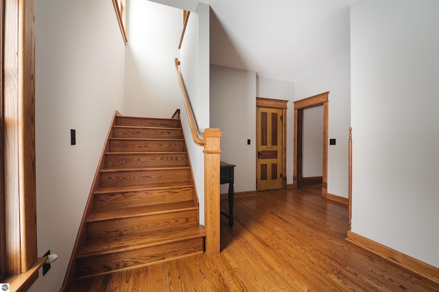 stairway featuring hardwood / wood-style flooring