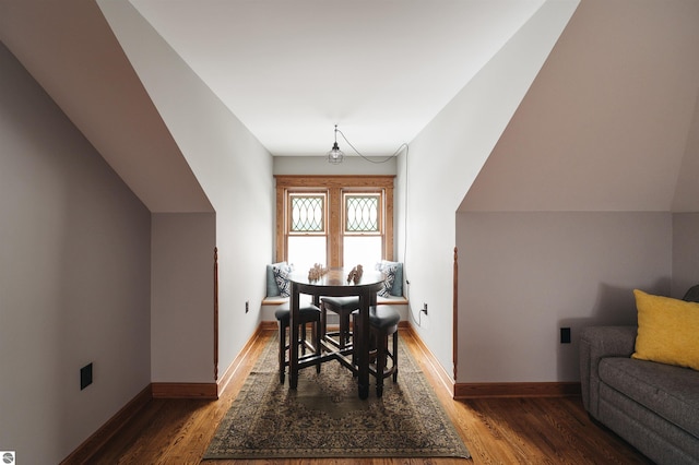 dining room with dark hardwood / wood-style flooring