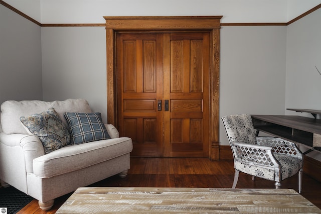 interior space featuring crown molding and dark hardwood / wood-style flooring