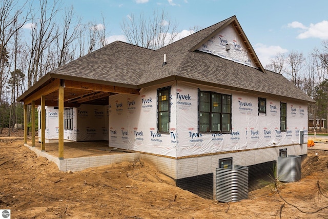 TBB3463 Autumn Leaf Dr, Traverse City, MI 49686 - view of front of property featuring covered porch and a shingled roof