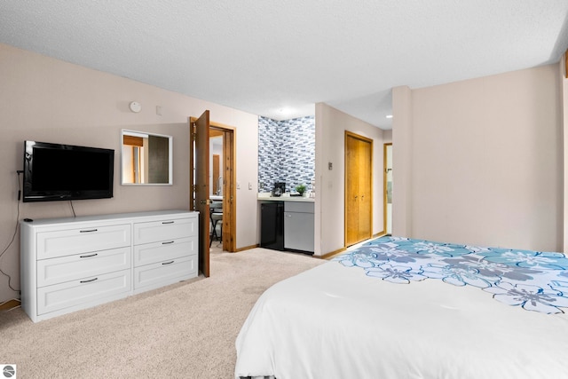 carpeted bedroom with a textured ceiling