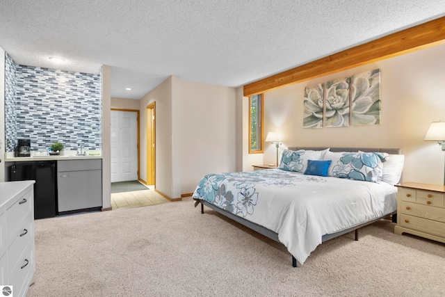 carpeted bedroom featuring a textured ceiling