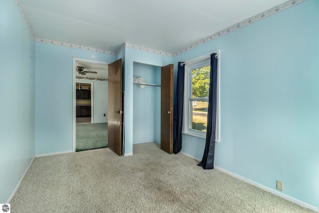 unfurnished bedroom with light colored carpet