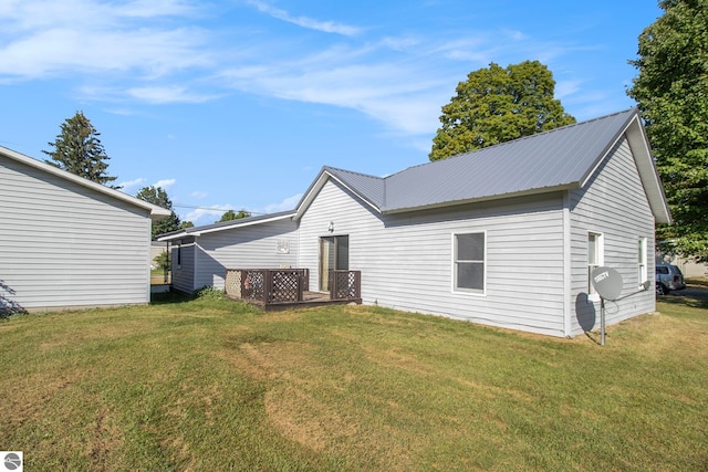 back of property featuring a lawn