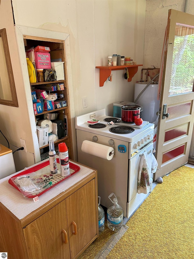 kitchen with electric range and tile counters