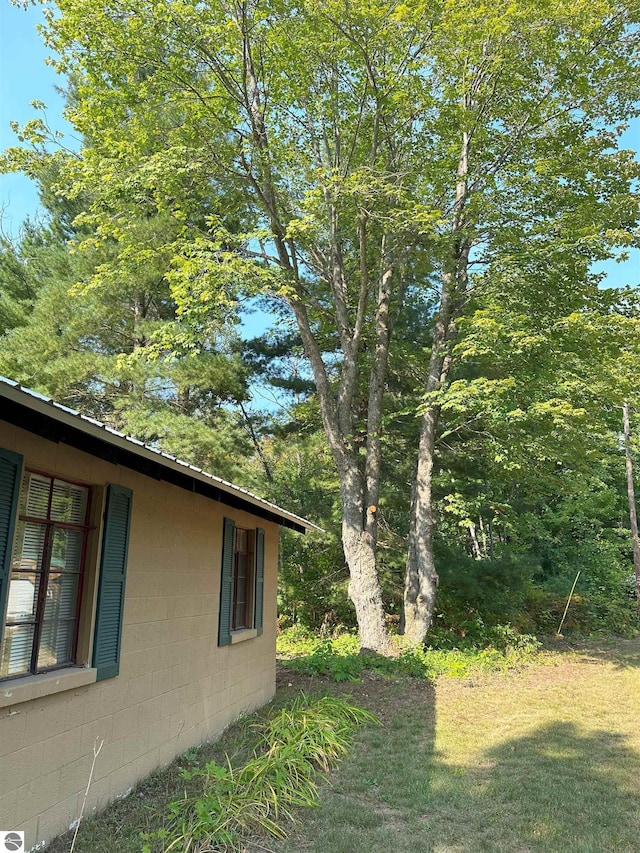 view of home's exterior with concrete block siding
